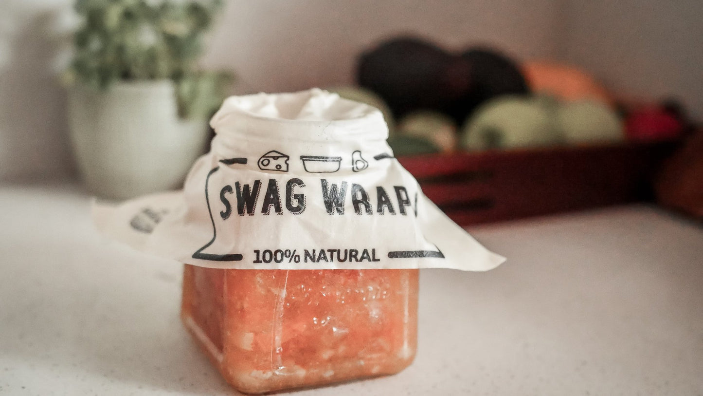 The Swag plant based reusable wrap being used over a glass jar to seal in freshness - TheSwag AU