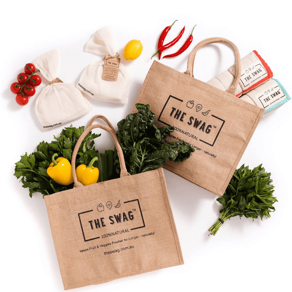 The Swag Plastic-Free Shopping Bundle showing all six items laid out with fresh produce in and around them - The Swag AU