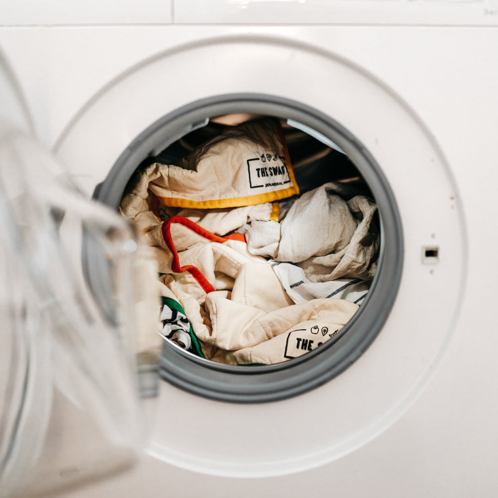 
                      
                        The Swag reusable produce bags being washed in the washing machine - The Swag AU
                      
                    