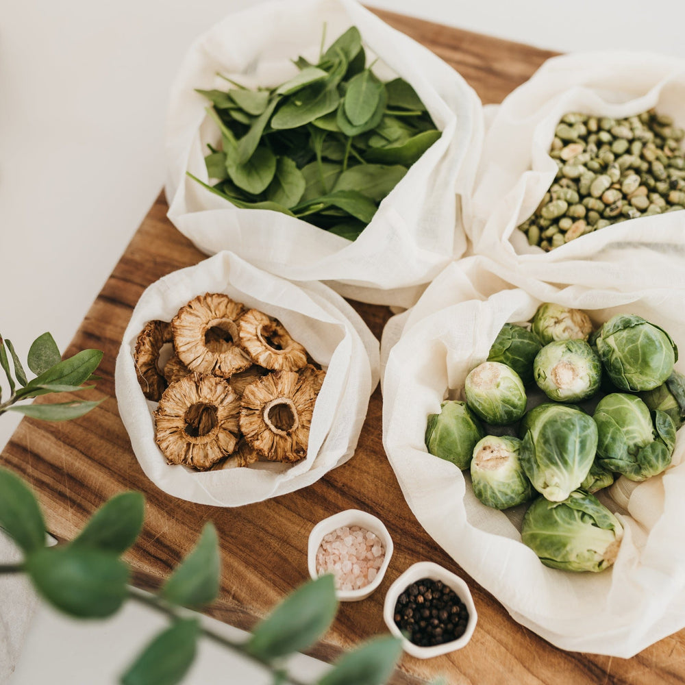 
                      
                        A set of four 100% natural, lightweight reusable produce bags filled with nuts, brussel sprouts and loose leaves used to replace plastic bags - The Swag AU
                      
                    
